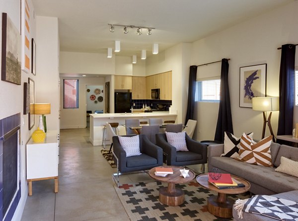 Modern living room and kitchen with stylish furniture and decor in luxury apartments