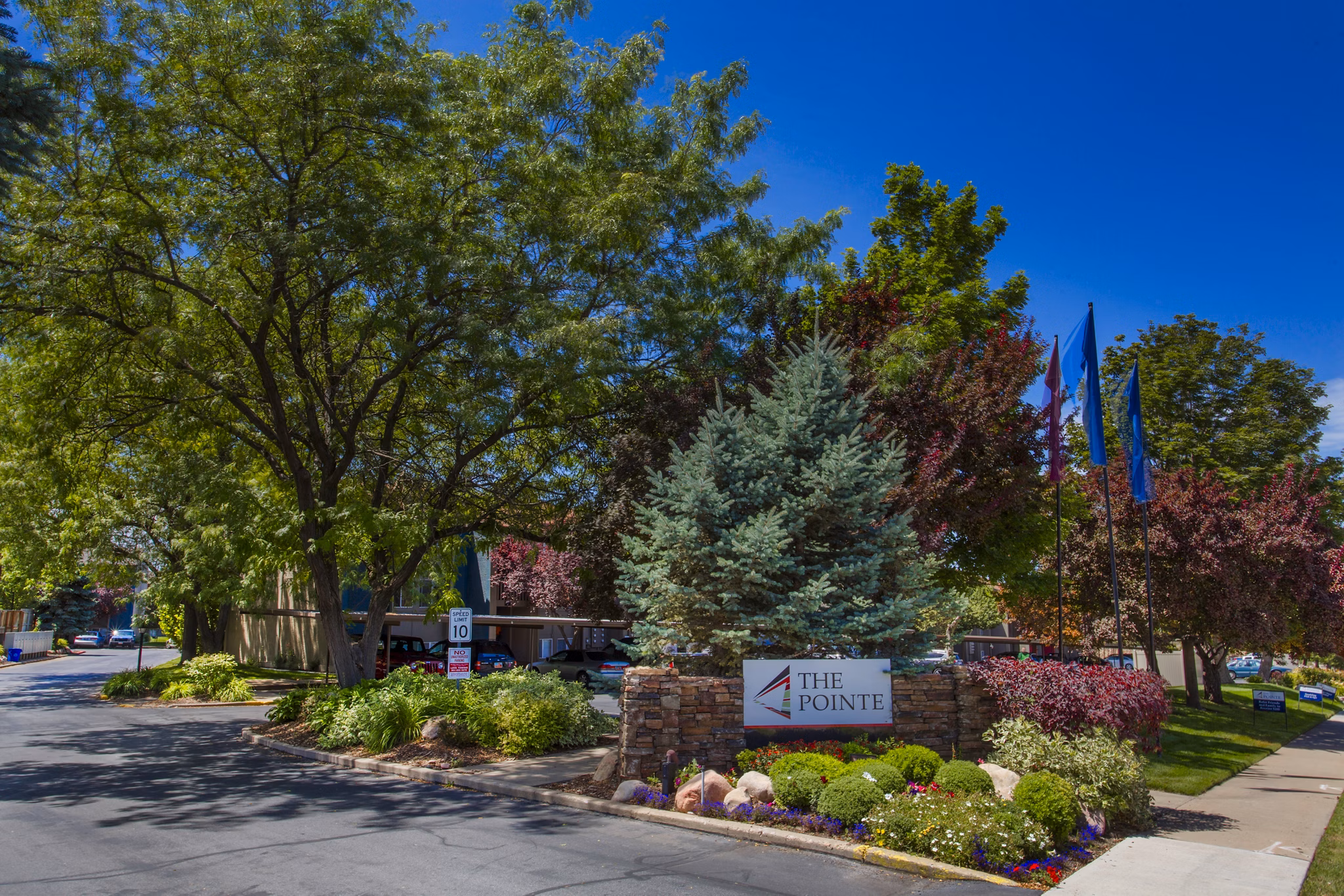 The Pointe at Northridge: Elegant entrance of luxury apartments in a serene suburban setting