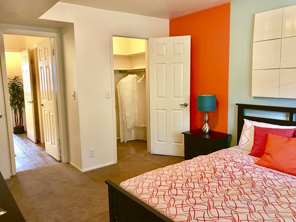 Elegant bedroom with modern furnishings at The Pointe at Northridge luxury apartments