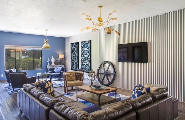 Clubhouse featuring modern dÃ©cor and cozy seating at The Pointe at Northridge luxury apartments
