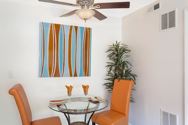 Bright dining area with modern furnishings at The Pointe at Northridge luxury apartments