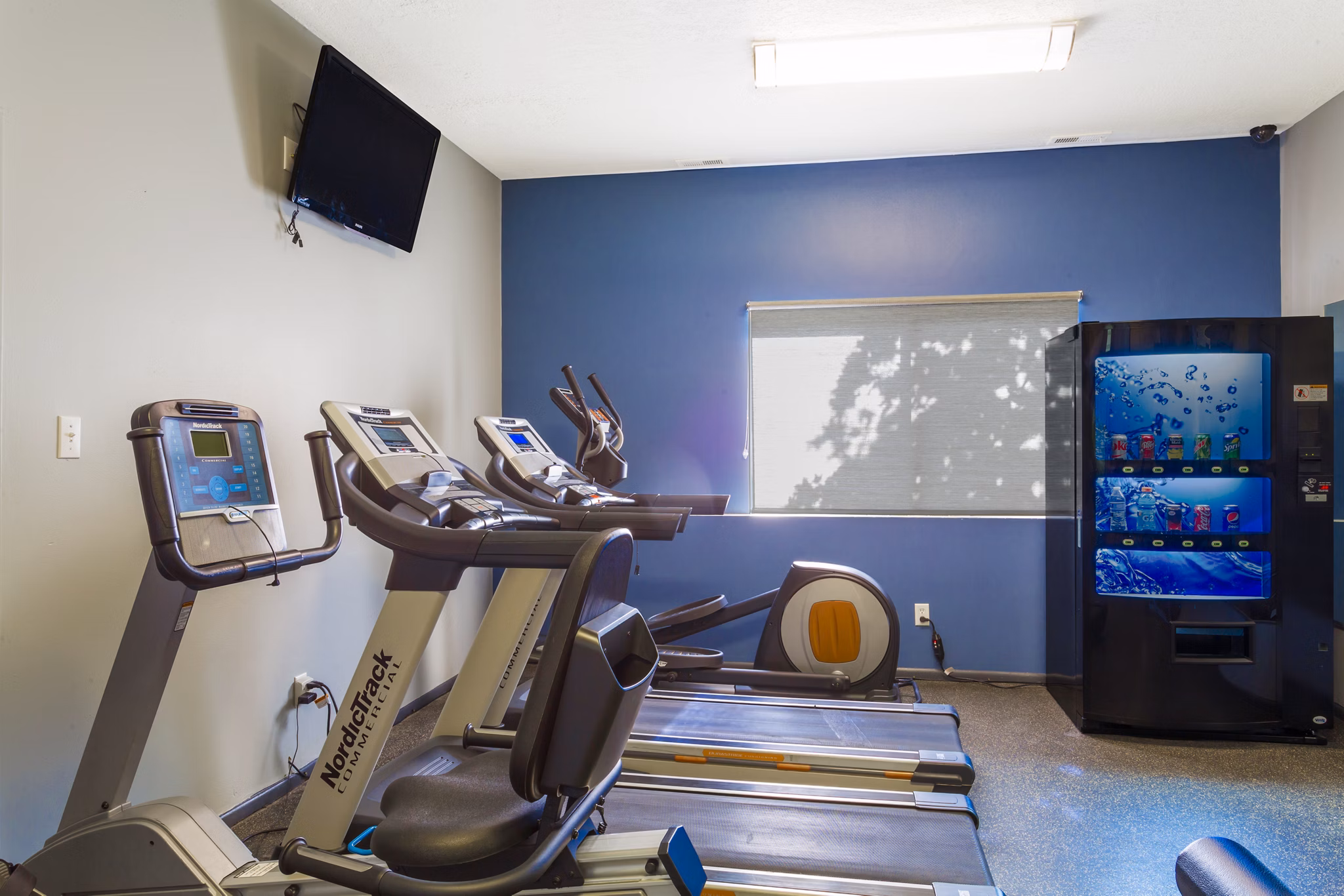 Modern fitness room with state-of-the-art equipment at The Pointe at Northridge luxury apartments