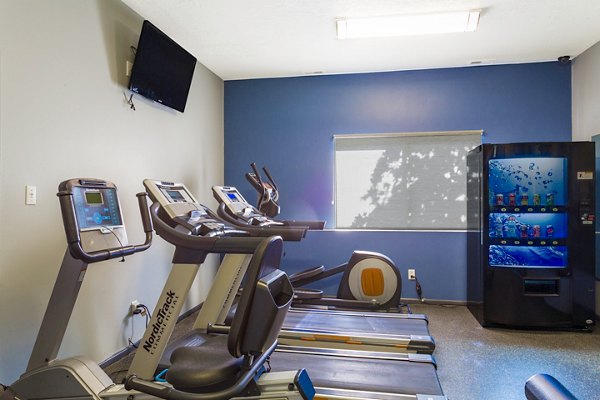 Modern fitness room with state-of-the-art equipment at The Pointe at Northridge luxury apartments