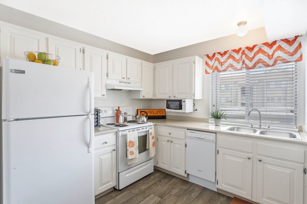 Modern kitchen with stainless steel appliances at The Pointe at Northridge