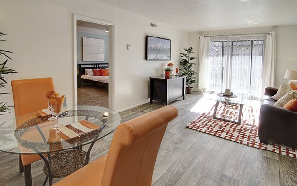 Living room featuring chic decor and natural light at The Pointe at Northridge's luxury apartments