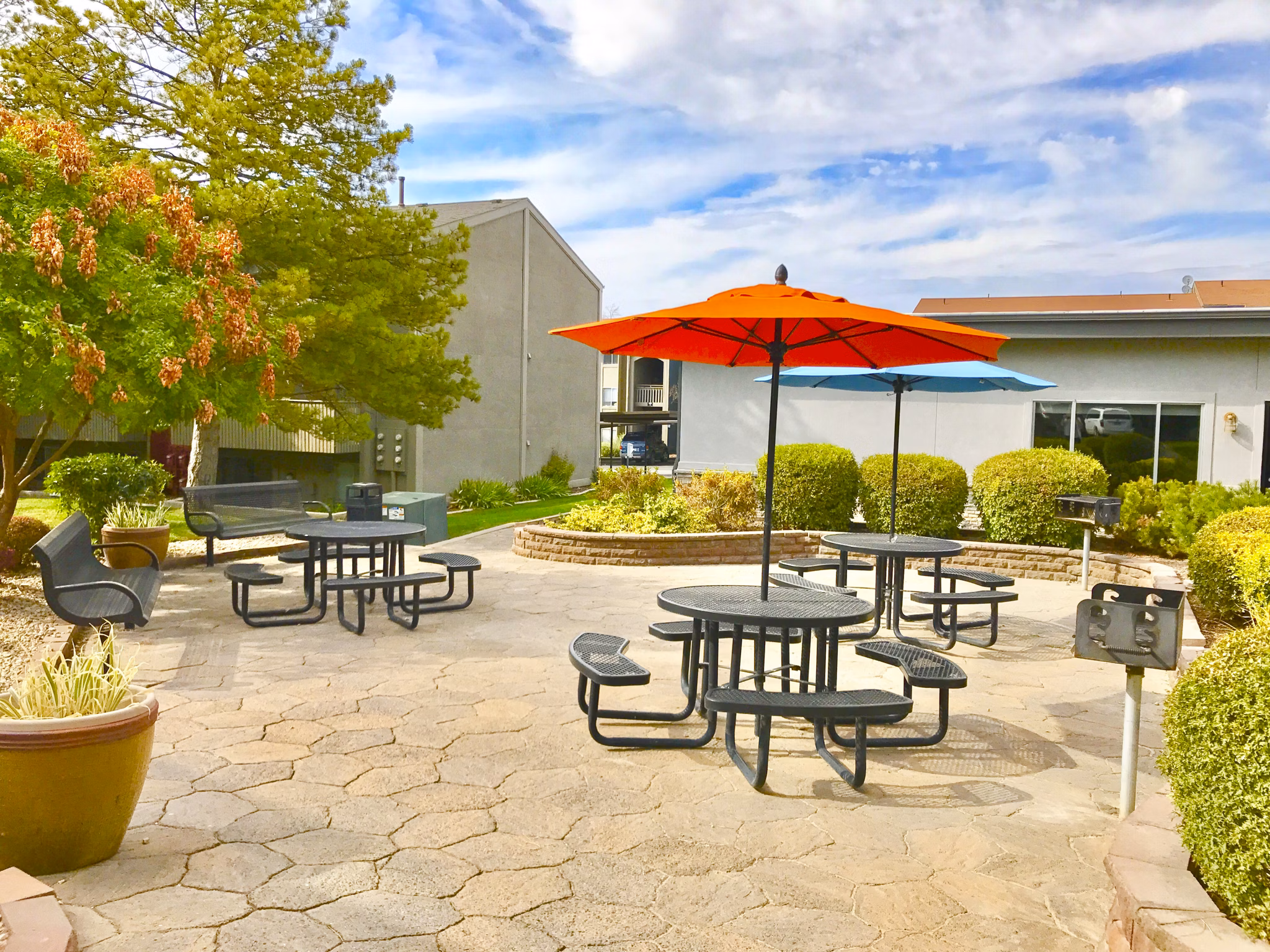 Private patio space with cozy outdoor seating at The Pointe at Northridge luxury apartments