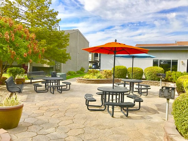 Private patio space with cozy outdoor seating at The Pointe at Northridge luxury apartments