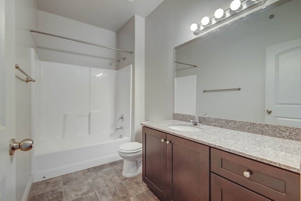 Elegant bathroom with modern fixtures in Villas on Main Apartments, offering luxury living near downtown Ideal for comfort and style