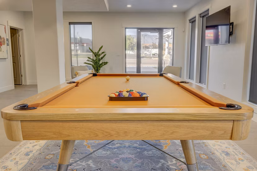 Game room featuring pool table and modern decor at Villas on Main Apartments