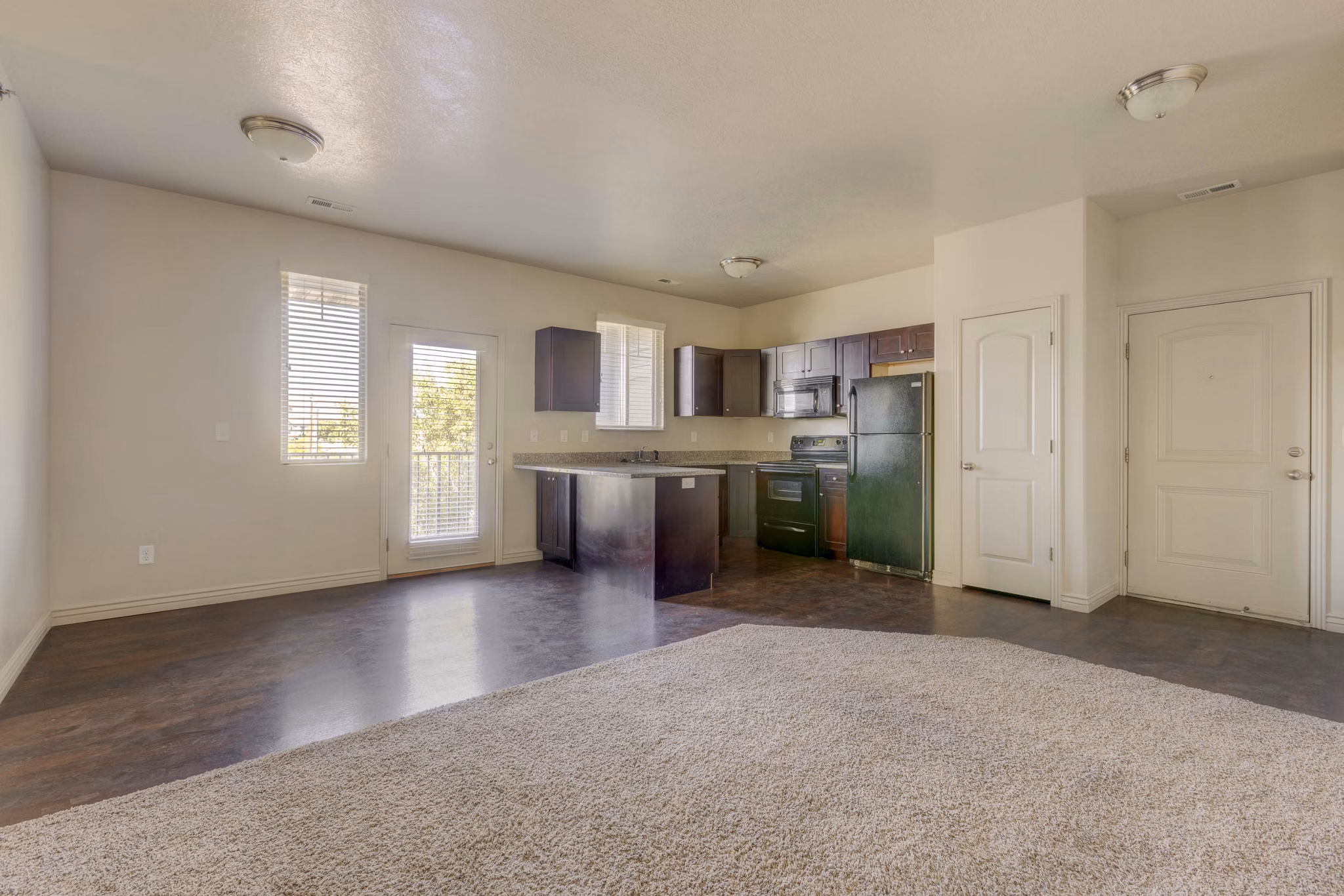 Spacious kitchen with modern appliances in Villas on Main Apartments