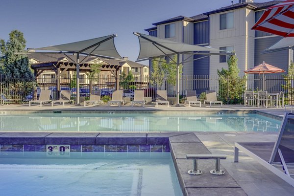 Luxury pool area at Villas on Main Apartments, offering relaxation and recreation for residents