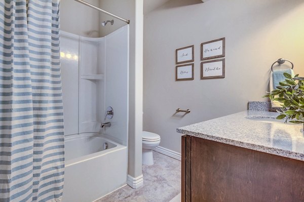 Modern bathroom featuring sleek fixtures at Pinnacle Highbury Apartments