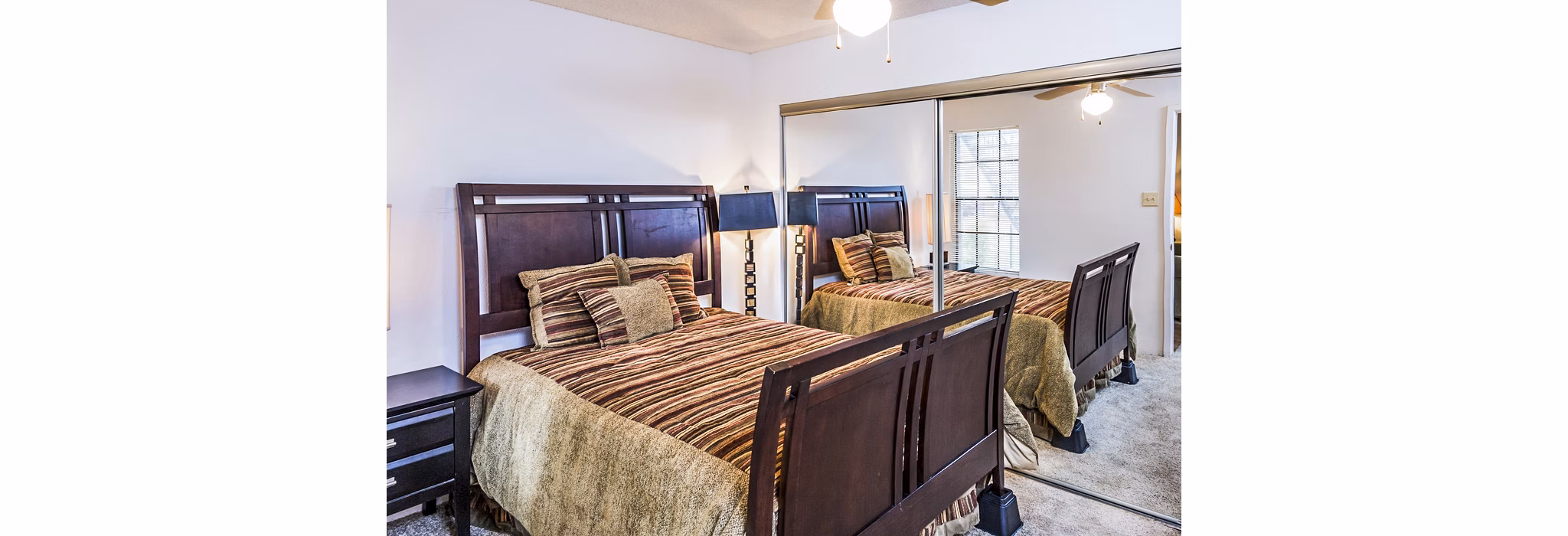 Cozy bedroom featuring stylish decor at Fountainhead Apartments