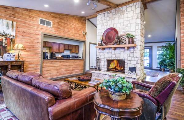 Elegant clubhouse/lobby with modern decor at Fountainhead Apartments, featuring luxurious seating areas and ambient lighting