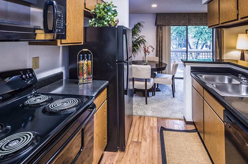 Modern kitchen with stainless steel appliances at Fountainhead Apartments