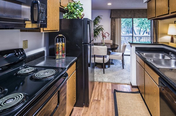 Modern kitchen with stainless steel appliances at Fountainhead Apartments