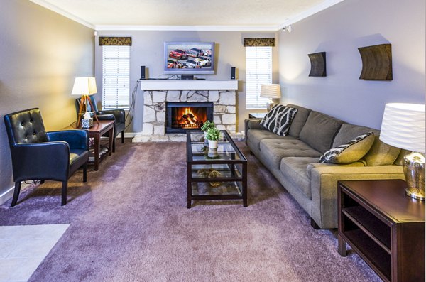 Spacious living room with stylish decor in Fountainhead Apartments, ideal for luxury living