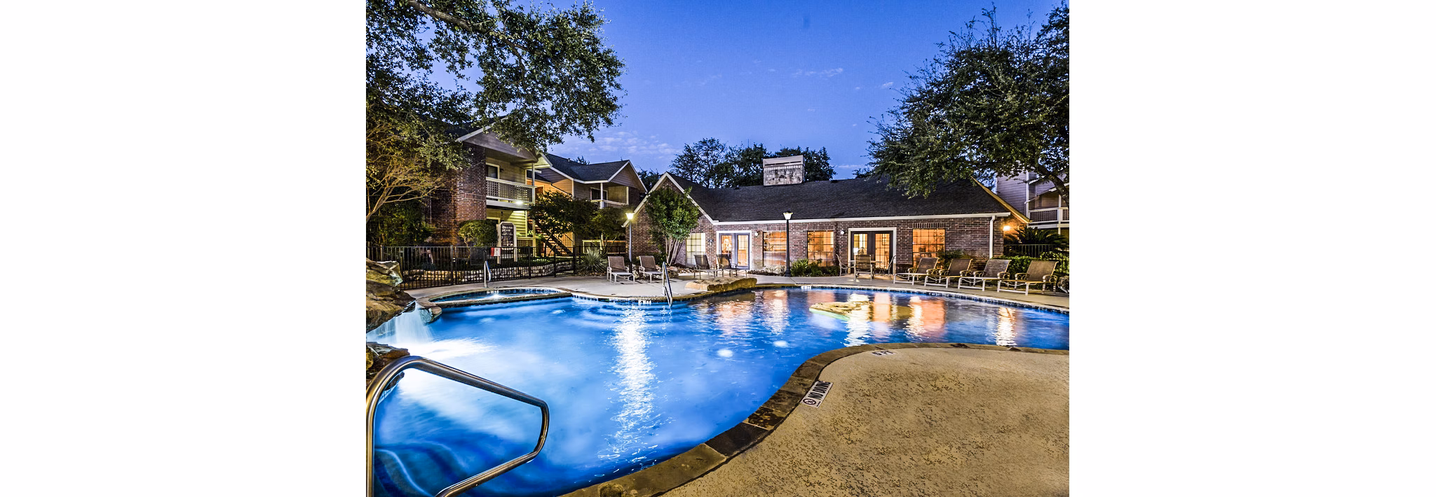 Modern pool with lounge chairs at Fountainhead Apartments, a Greystar luxury community