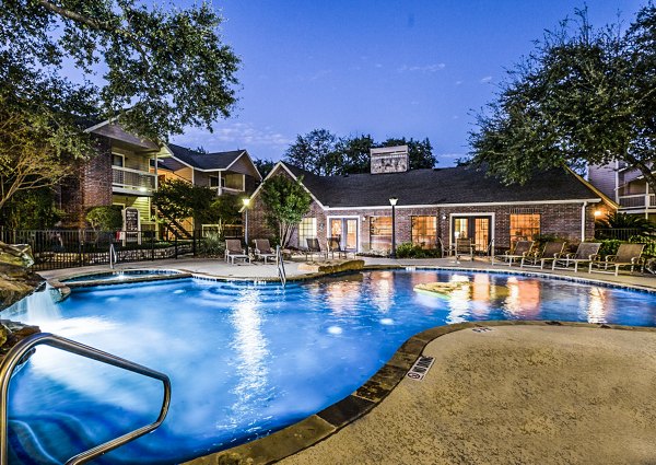 Modern pool with lounge chairs at Fountainhead Apartments, a Greystar luxury community