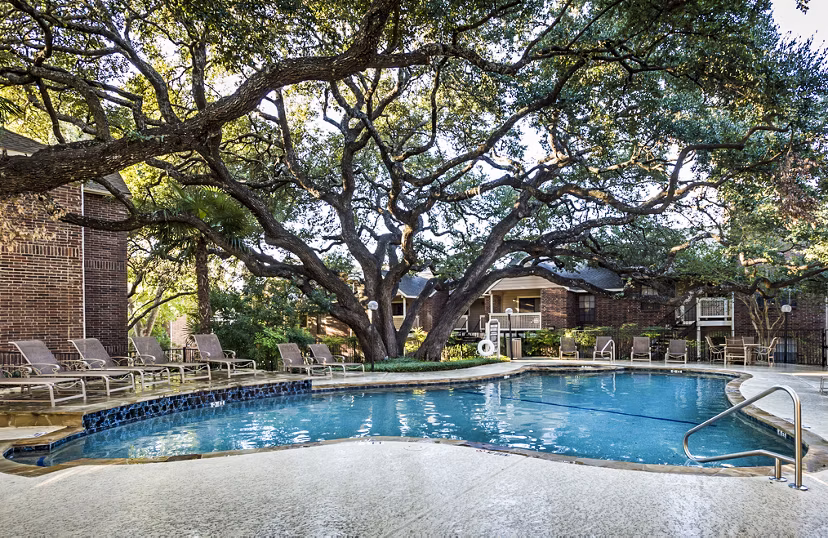 Luxurious pool area with comfortable lounge chairs at Fountainhead Apartments