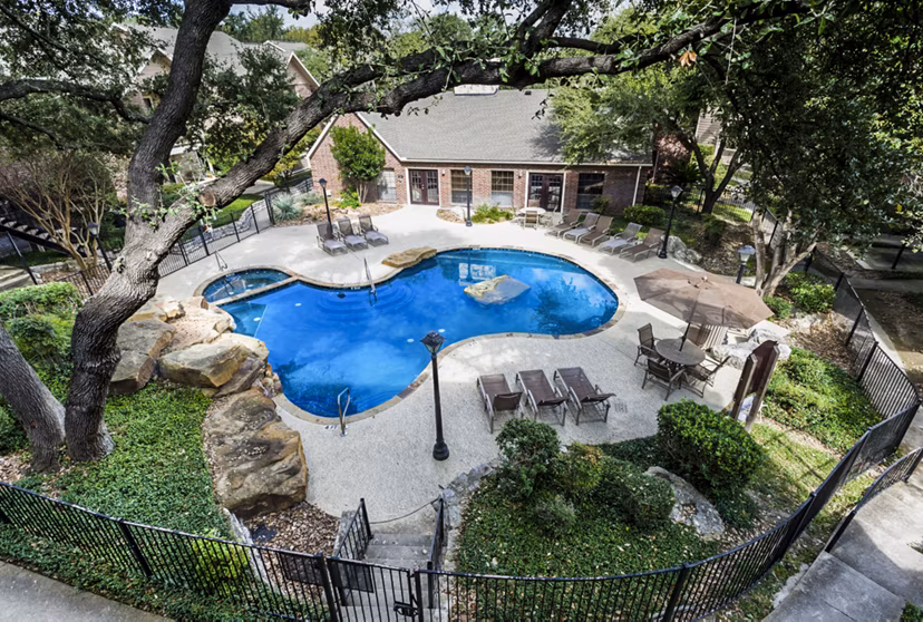 Luxury pool area at Fountainhead Apartments featuring comfortable lounge seating and scenic views