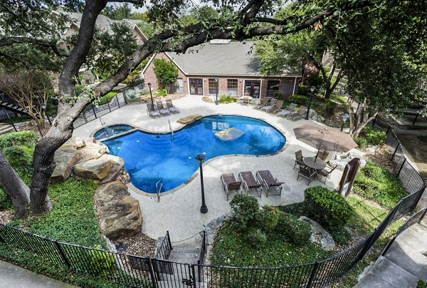 Luxury pool area at Fountainhead Apartments featuring comfortable lounge seating and scenic views
