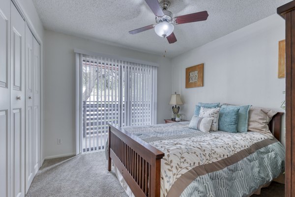Modern bedroom featuring sleek furnishings and ample natural light at Landera Apartments