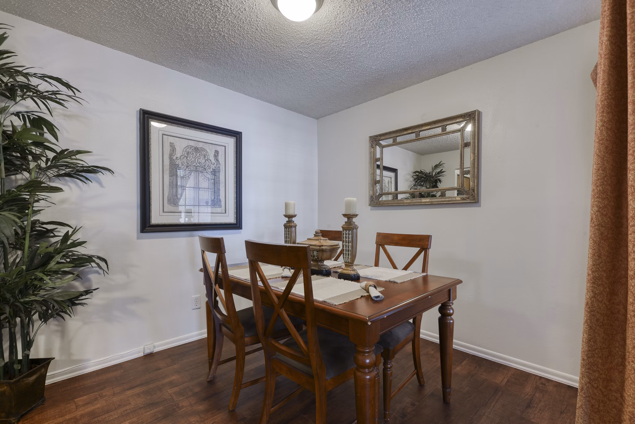 Dining area featuring modern furnishings and large windows at Landera Apartments