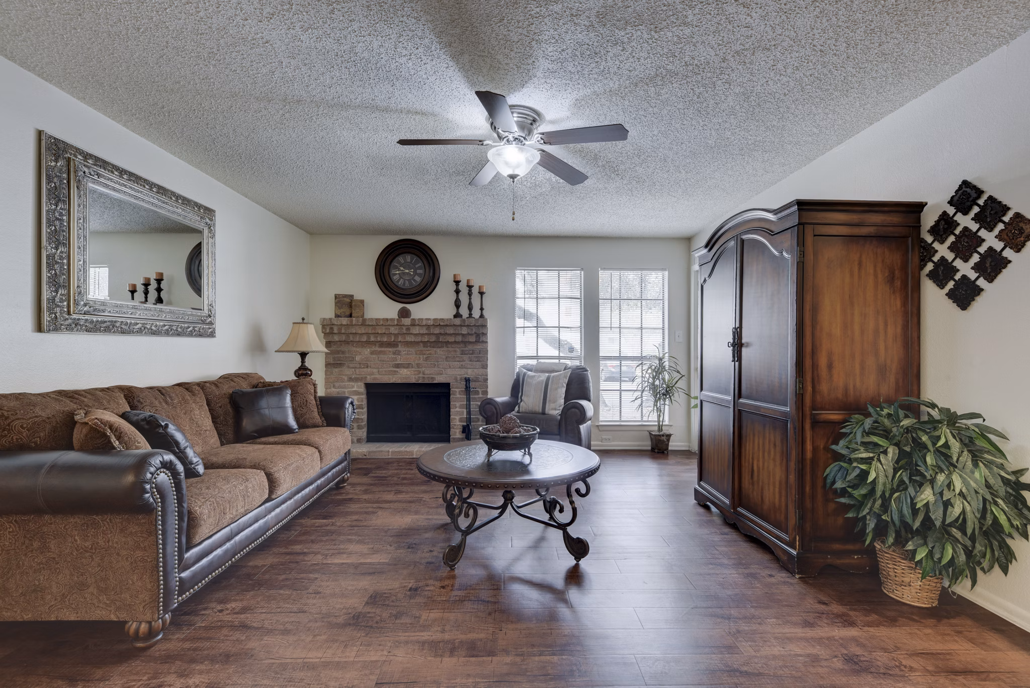 Spacious living room featuring modern furnishings and natural light at Landera Apartments