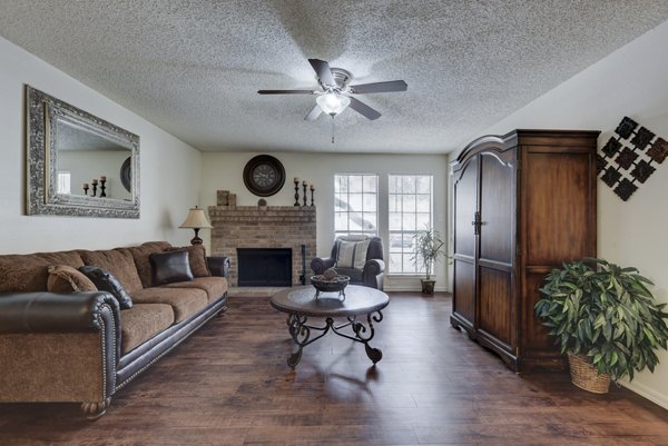 Spacious living room featuring modern furnishings and natural light at Landera Apartments