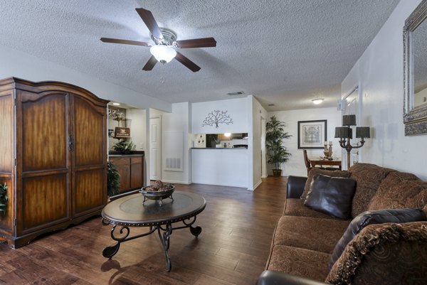 Cozy living room with modern furniture and bright decor in Landera Apartments, providing comfort and style in a luxury setting