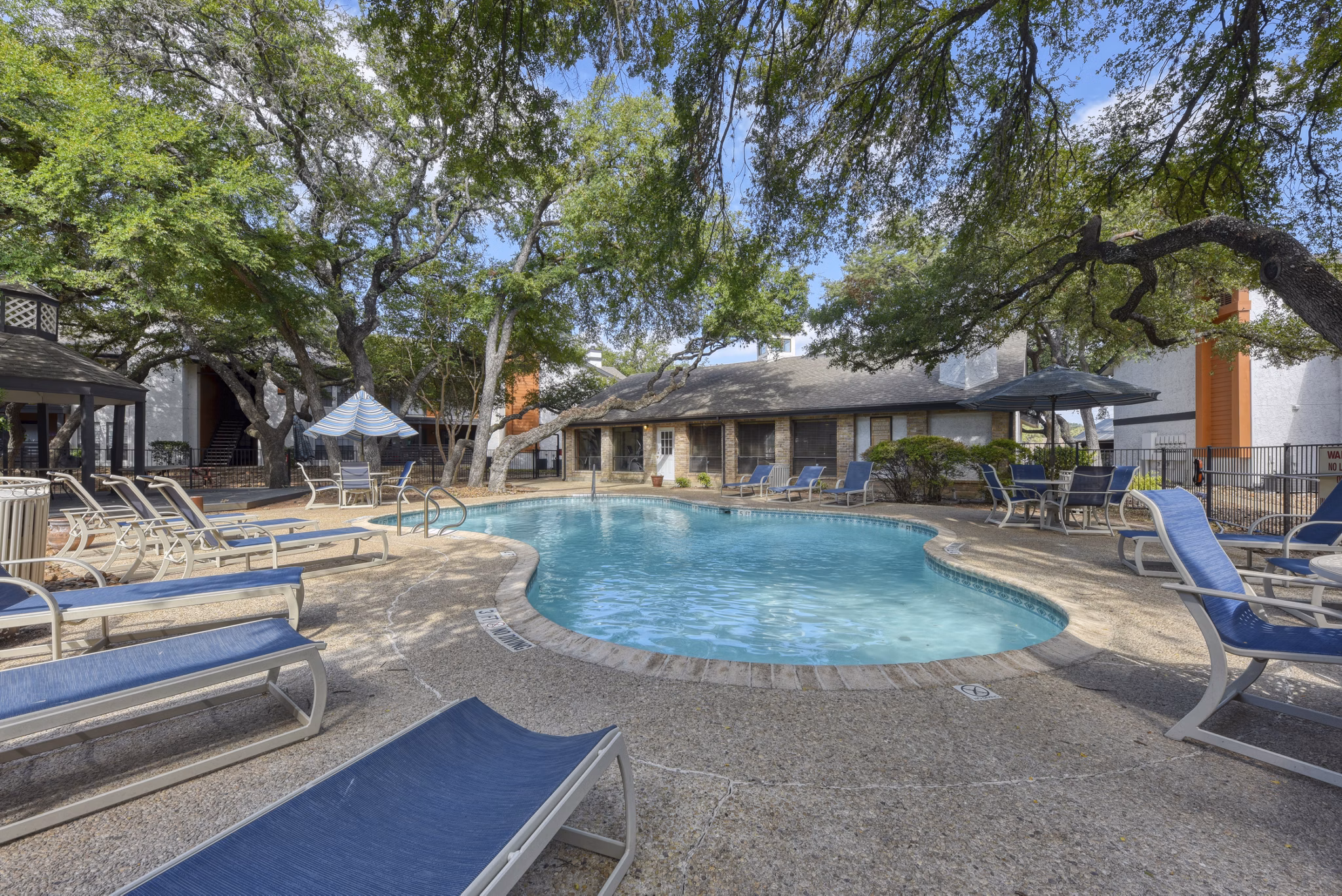 Resort-style pool at Landera Apartments in a serene garden setting