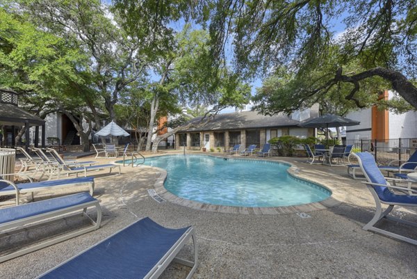Resort-style pool at Landera Apartments in a serene garden setting