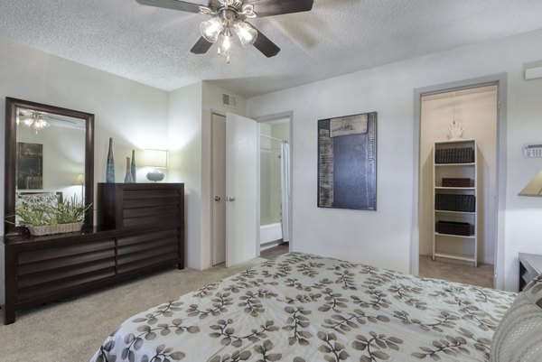 Cozy bedroom with modern furnishings at Broadstone Medical Apartments