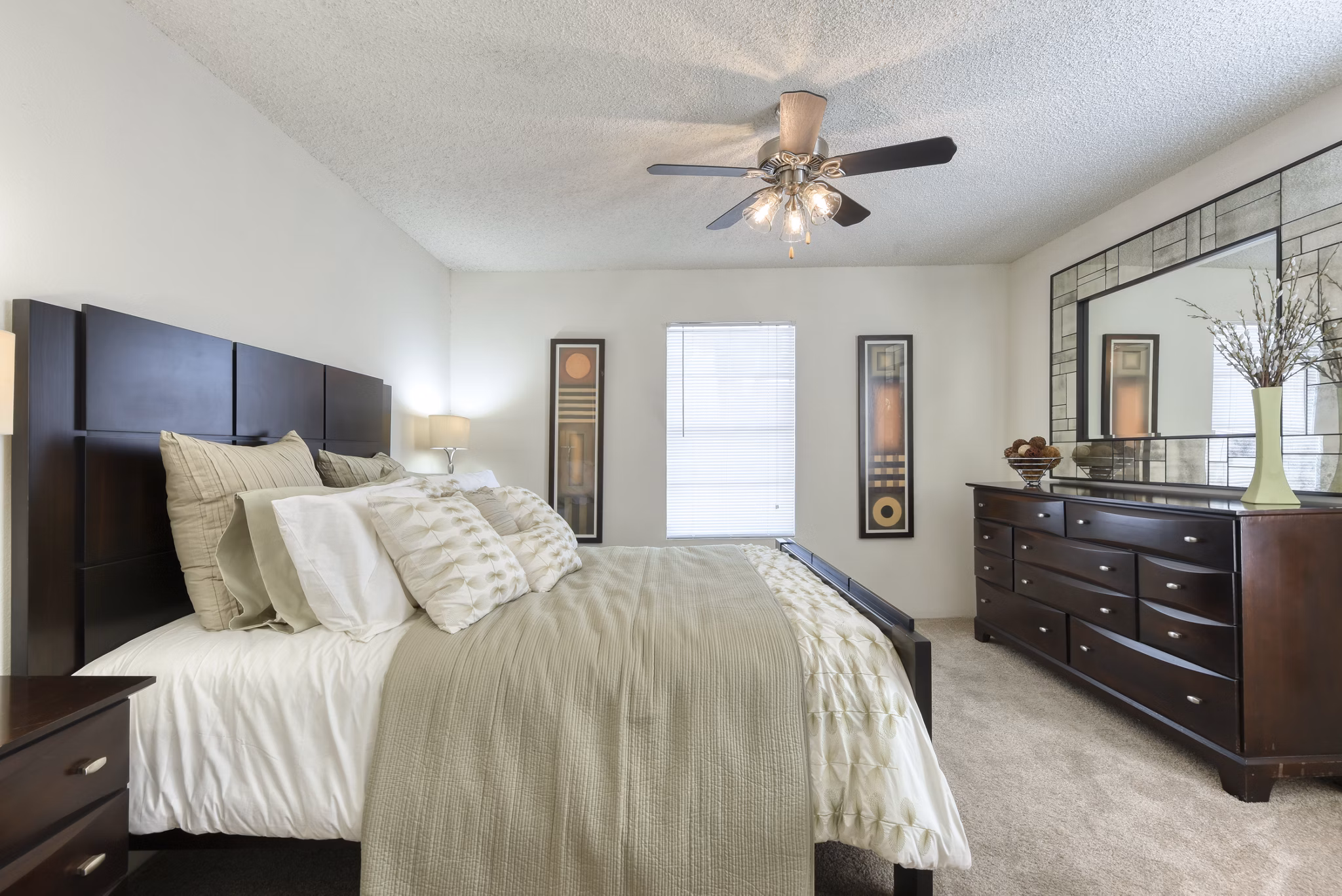Modern bedroom with sleek furniture and large windows at Broadstone Medical Apartments