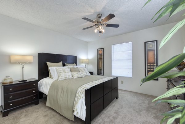 Cozy bedroom with modern furnishings at Broadstone Medical Apartments, offering luxury living near medical centers