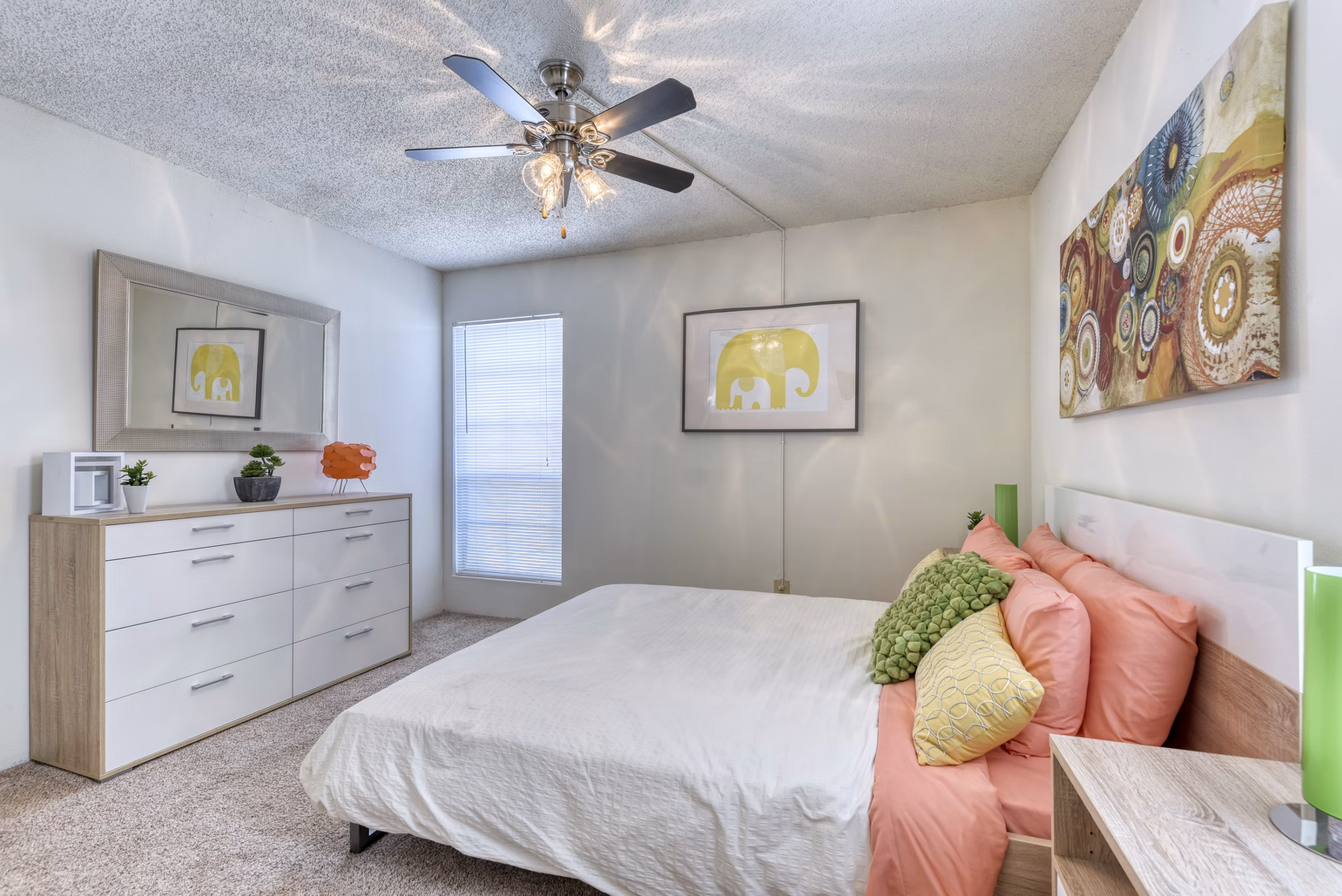 Elegant bedroom with plush furnishings and natural light at Broadstone Medical Apartments