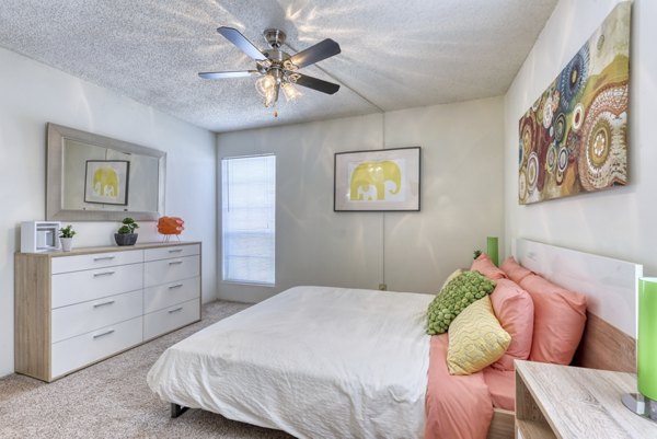 Elegant bedroom with plush furnishings and natural light at Broadstone Medical Apartments