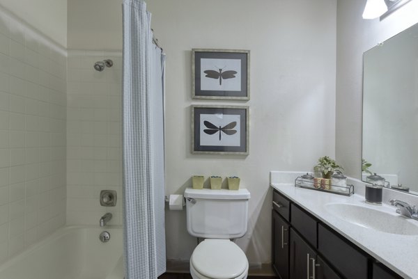 Bathroom with sleek fixtures and modern vanity in Broadstone Medical Apartments