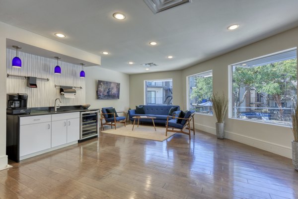 Clubhouse featuring modern design and ample seating at Broadstone Medical Apartments