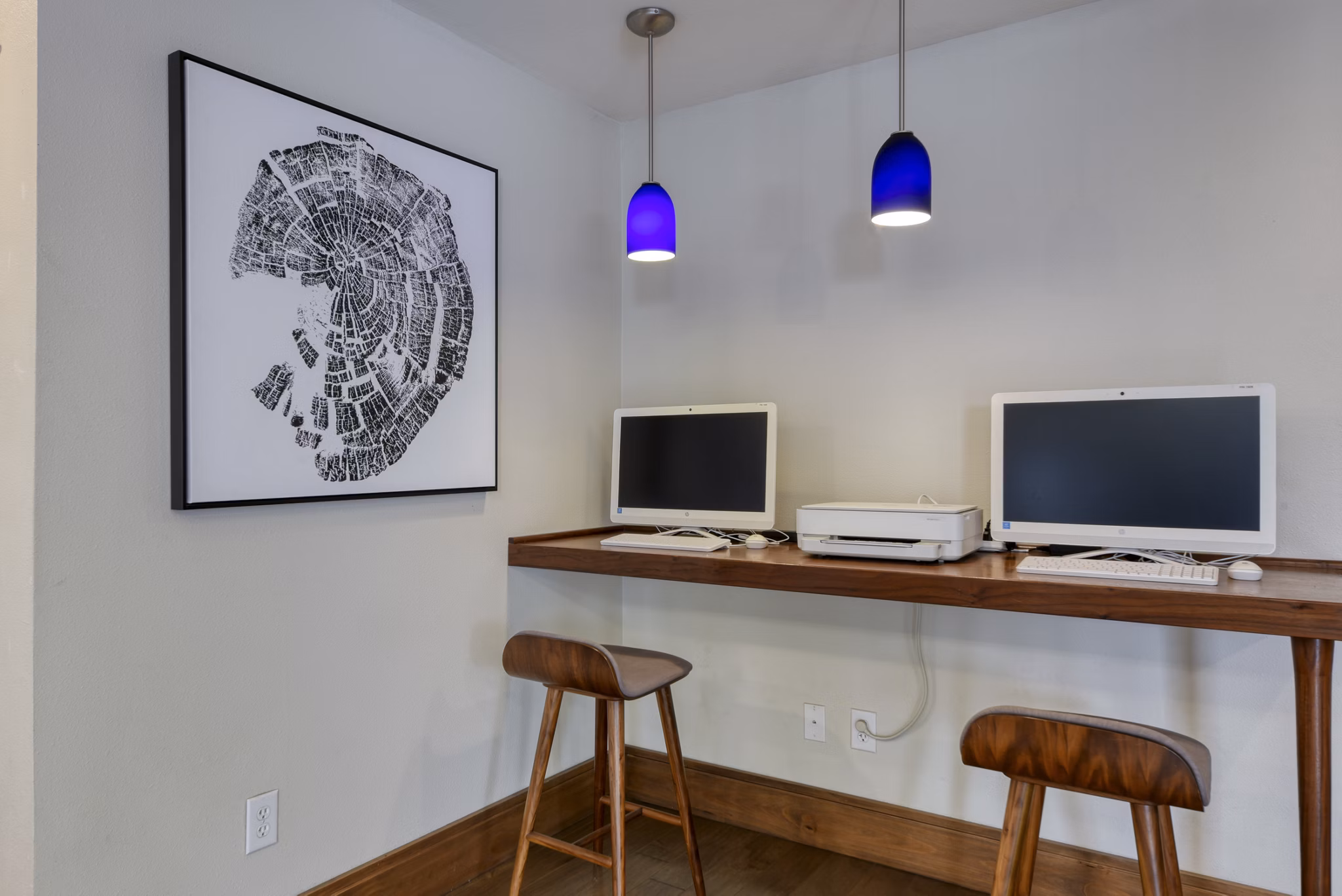Business center with sleek workstations at Broadstone Medical Apartments, offering modern amenities and collaborative environments