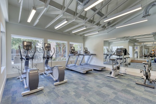 Fitness center with modern equipment at Broadstone Medical Apartments