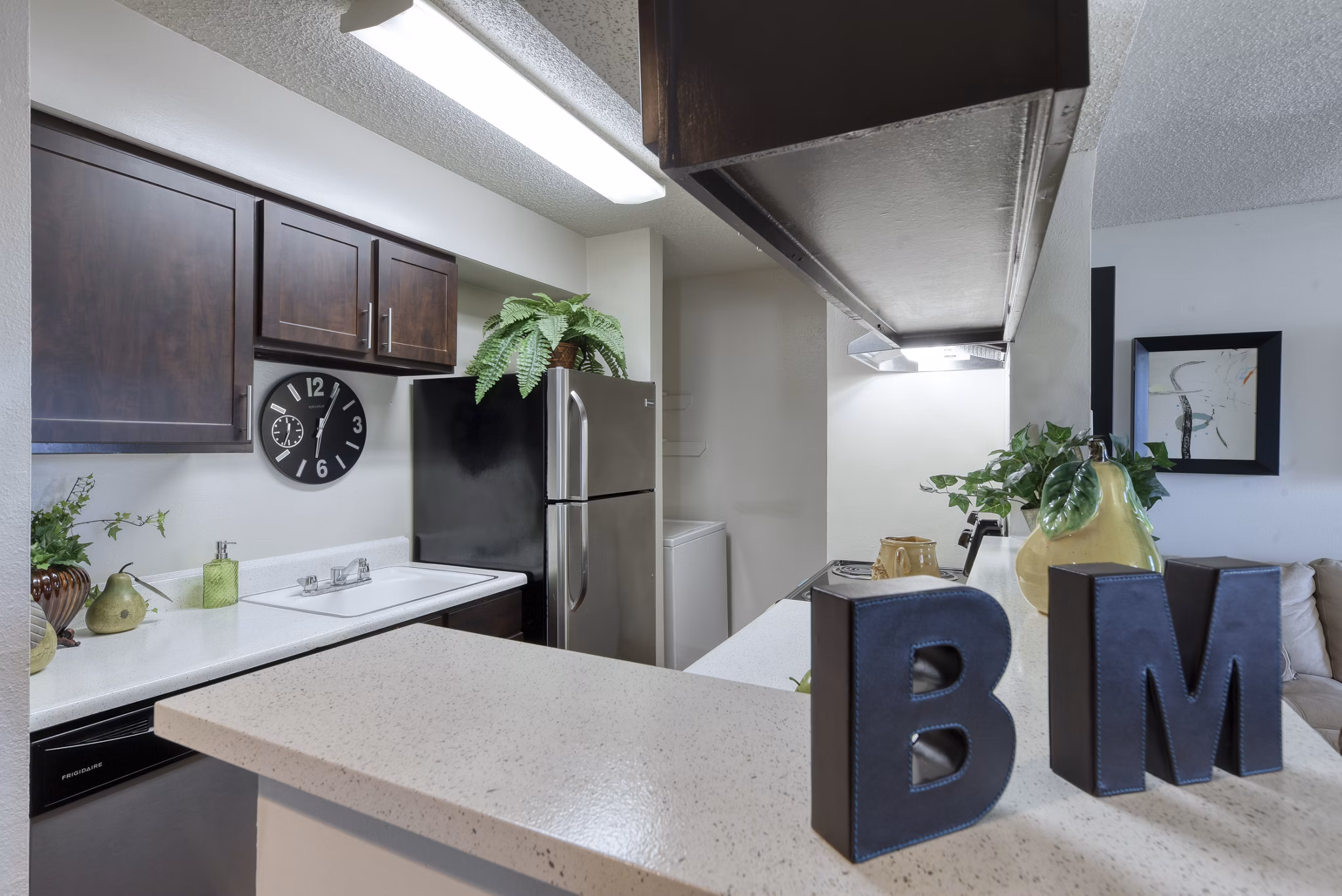 Modern kitchen with stainless steel appliances at Broadstone Medical Apartments, offering luxury living spaces near medical centers