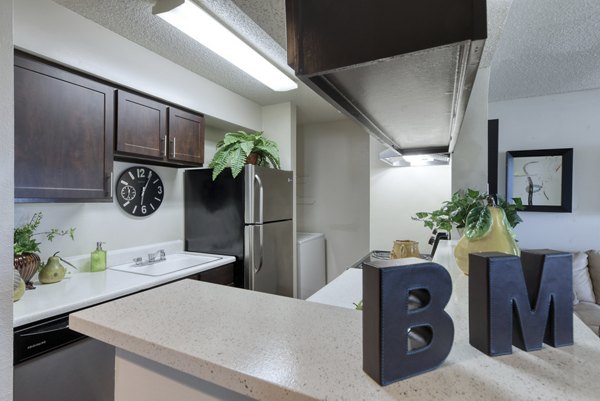 Modern kitchen with stainless steel appliances at Broadstone Medical Apartments, offering luxury living spaces near medical centers