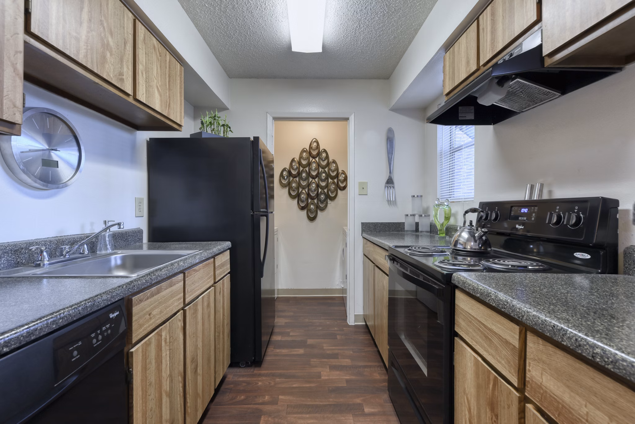 Modern kitchen featuring sleek countertops and stainless steel appliances in Broadstone Medical Apartments