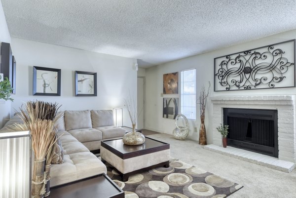 Spacious living room with modern decor in Broadstone Medical Apartments, featuring comfortable seating and city views