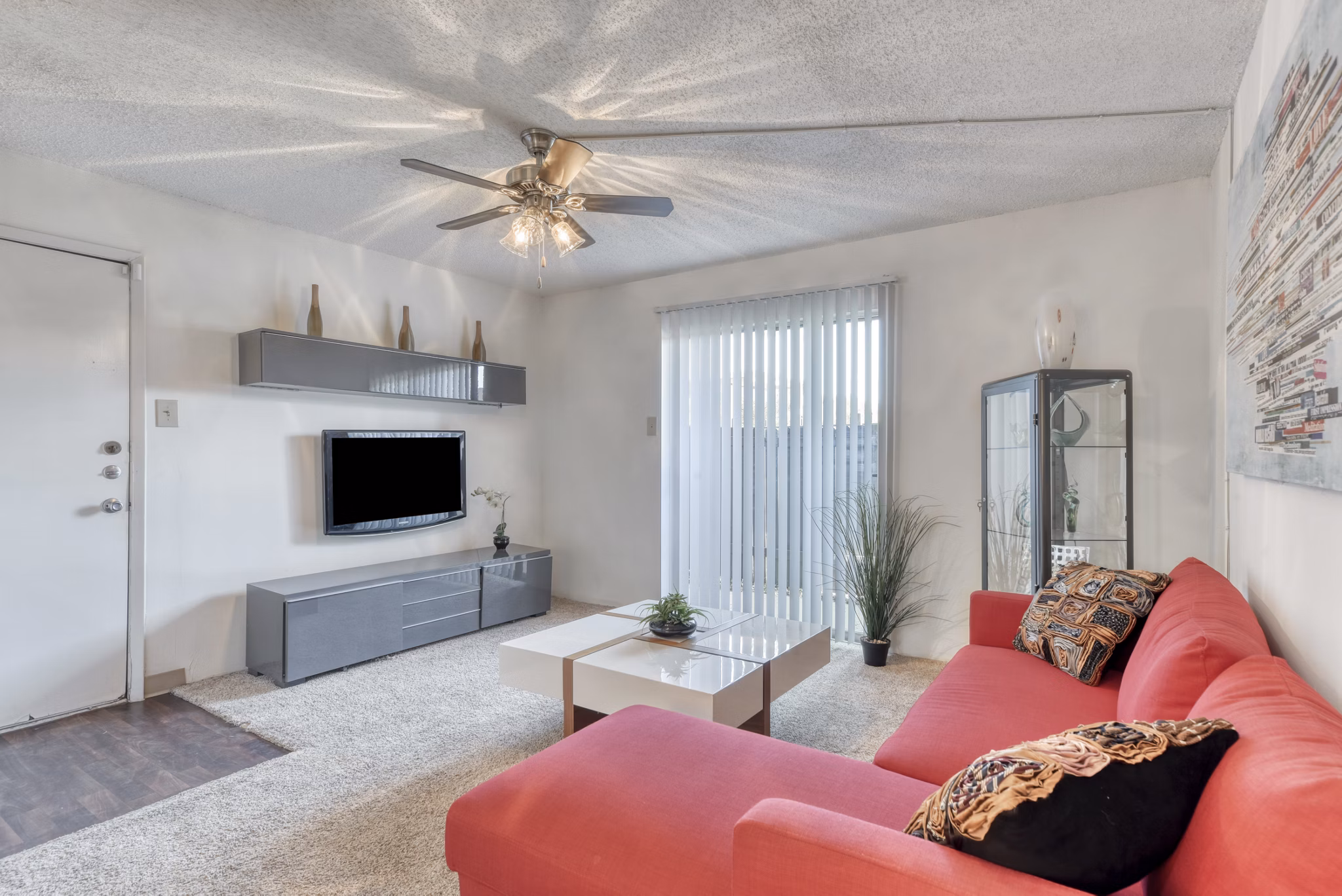 Modern living room with plush seating and large windows at Broadstone Medical Apartments