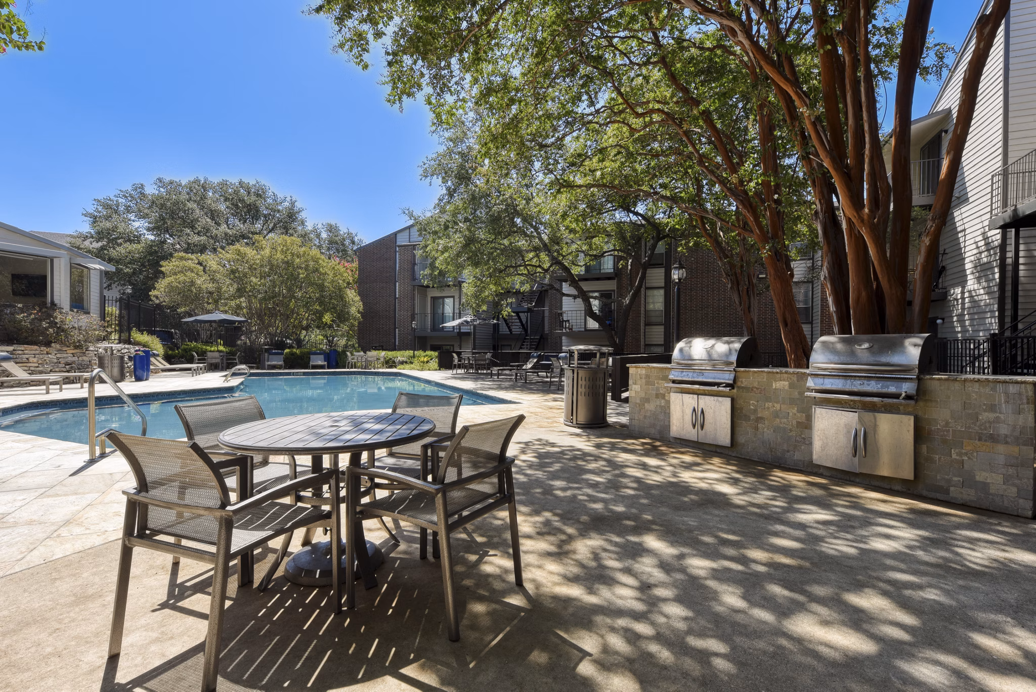 Outdoor grill area with modern BBQ facilities at Broadstone Medical Apartments