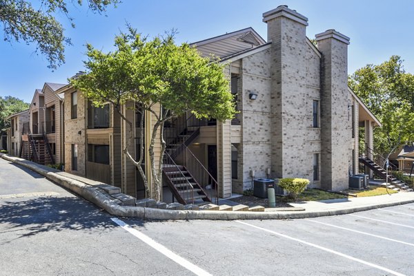 Woods of Elm Creek: Elegant low-rise apartments surrounded by lush greenery