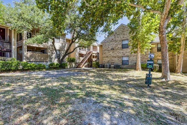 Dog-friendly park with agility course at Woods of Elm Creek Apartments, ideal for pet owners seeking outdoor fun and convenience